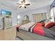 Serene bedroom with a ceiling fan, creating a peaceful retreat at 675 Elbridge Dr, Kissimmee, FL 34758