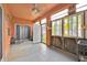 Enclosed sunroom with lots of windows, offering an abundance of natural light at 675 Elbridge Dr, Kissimmee, FL 34758