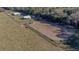 Aerial view of the horse training area and paddocks, in an open grassy area at 2198 W Highway 329, Citra, FL 32113