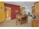 The dining area showcases a western theme, with a view of the front door and living room in the background at 2198 W Highway 329, Citra, FL 32113