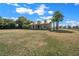 Charming home with a metal roof, dormers, and a wide front porch, surrounded by a green lawn and mature trees at 2198 W Highway 329, Citra, FL 32113