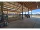 Another view inside the horse barn with concrete flooring and stalls at 2198 W Highway 329, Citra, FL 32113