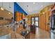 Kitchen with wooden cabinetry, granite countertops, and access to the outside through double doors at 2198 W Highway 329, Citra, FL 32113