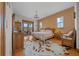 Spacious main bedroom features wood floors, chandelier, and sliding glass doors to exterior at 2198 W Highway 329, Citra, FL 32113