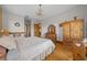 Bright main bedroom boasts wood floors and rustic-style wood furnishings at 2198 W Highway 329, Citra, FL 32113