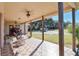 Covered patio with tile floor and wooden support beams providing outdoor living space at 2198 W Highway 329, Citra, FL 32113