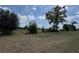 Lush backyard with mature trees and natural greenery, offering a serene and private outdoor space at 6711 Sw 64Th Ave, Ocala, FL 34476