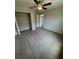 Bedroom with neutral walls, a ceiling fan, and a closet at 6711 Sw 64Th Ave, Ocala, FL 34476