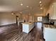 Modern kitchen with a spacious island, sleek countertops, stainless steel appliances, and ample lighting at 6711 Sw 64Th Ave, Ocala, FL 34476