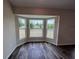 Bright room featuring three large windows offering scenic outdoor views and natural light at 6711 Sw 64Th Ave, Ocala, FL 34476