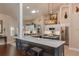 Modern kitchen with an eat-in island and stainless steel appliances at 10411 Sw 52Nd Ct, Ocala, FL 34476