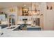 Stylish kitchen with stainless appliances, white cabinets, an island, and granite countertops at 10411 Sw 52Nd Ct, Ocala, FL 34476