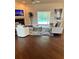 Inviting living room featuring a fireplace, comfortable seating, and access to the pool area at 10411 Sw 52Nd Ct, Ocala, FL 34476