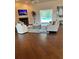 Inviting living room featuring a fireplace, comfortable seating, and access to the pool area at 10411 Sw 52Nd Ct, Ocala, FL 34476