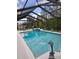 Relaxing screened-in pool with beautiful blue water and outdoor seating area, perfect for entertaining guests at 10411 Sw 52Nd Ct, Ocala, FL 34476