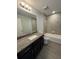 Bathroom featuring a vanity, granite countertops, tiled floors, and bathtub-shower combo at 7051 Sw 64Th Ter, Ocala, FL 34476