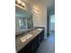 Bathroom with double sinks and granite countertops, along with an expansive shower at 7051 Sw 64Th Ter, Ocala, FL 34476