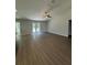 Bright living room featuring recessed lighting, luxury vinyl flooring, and a patio door leading to the backyard at 7051 Sw 64Th Ter, Ocala, FL 34476