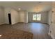 Open floor plan featuring modern flooring and an elegant chandelier above the dining area at 7051 Sw 64Th Ter, Ocala, FL 34476