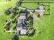 Expansive estate featuring lush green grounds, golf course, pool, and sprawling home at 10621 Sw 11Th Ter, Ocala, FL 34476