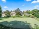 Expansive backyard features a private golf course, lush landscaping, and plenty of room to relax at 10621 Sw 11Th Ter, Ocala, FL 34476