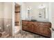 Elegant bathroom with a stone vanity, vessel sink, and luxurious tiled walk-in shower at 10621 Sw 11Th Ter, Ocala, FL 34476