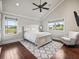 Bedroom featuring hardwood floors, vaulted ceilings, natural light, and comfortable seating at 10621 Sw 11Th Ter, Ocala, FL 34476