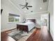 Bedroom with hardwood floors, vaulted ceilings, and natural light with exterior views at 10621 Sw 11Th Ter, Ocala, FL 34476