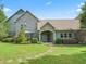 Charming front exterior with stone accents, well-maintained landscaping, and a welcoming entrance at 10621 Sw 11Th Ter, Ocala, FL 34476