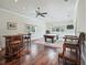 Game room with a pool table, bar area, and hardwood flooring at 10621 Sw 11Th Ter, Ocala, FL 34476