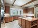 Gourmet kitchen featuring a large island, granite countertops, stainless steel appliances, and ample cabinet space at 10621 Sw 11Th Ter, Ocala, FL 34476