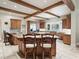 Well-appointed kitchen featuring custom cabinetry, granite countertops, and a large island with seating for guests at 10621 Sw 11Th Ter, Ocala, FL 34476