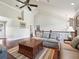 Spacious upstairs living room with high ceilings, comfortable seating, and hardwood flooring at 10621 Sw 11Th Ter, Ocala, FL 34476