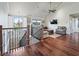 Upstairs living room featuring hardwood floors, chandelier, natural light and comfortable furniture at 10621 Sw 11Th Ter, Ocala, FL 34476