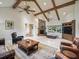 Spacious living room with vaulted ceilings, stone fireplace, and comfortable seating, perfect for relaxation at 10621 Sw 11Th Ter, Ocala, FL 34476