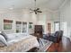 Large main bedroom featuring hardwood floors, high ceilings, a ceiling fan and natural light at 10621 Sw 11Th Ter, Ocala, FL 34476