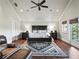 Comfortable main bedroom with hardwood floors, a ceiling fan, a rug and natural light at 10621 Sw 11Th Ter, Ocala, FL 34476