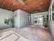 Bright sunroom with tile floors, wood ceilings, recessed lighting, and a ceiling fan at 10621 Sw 11Th Ter, Ocala, FL 34476