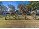 Charming home with a spacious backyard, featuring a patio and lush landscaping at 22345 Ne 108Th Avenue Rd, Fort Mc Coy, FL 32134