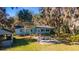 Ranch style home with a large backyard and stone patio at 22345 Ne 108Th Avenue Rd, Fort Mc Coy, FL 32134