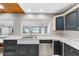 Kitchen with water views, dark cabinets, and a breakfast bar at 22345 Ne 108Th Avenue Rd, Fort Mc Coy, FL 32134