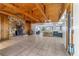 Spacious living room with stone fireplace and vaulted wood ceiling at 22345 Ne 108Th Avenue Rd, Fort Mc Coy, FL 32134