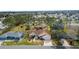 Charming home with lush landscaping, complemented by mature trees and manicured lawns at 8447 Se 137Th Loop, Summerfield, FL 34491