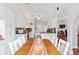Open dining area with a view into the kitchen, featuring granite countertops at 8447 Se 137Th Loop, Summerfield, FL 34491