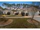 Charming single-story home with landscaped front yard, green shutters and a well-manicured lawn at 8447 Se 137Th Loop, Summerfield, FL 34491