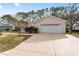 This home features an attached two-car garage and a spacious driveway for ample parking at 8447 Se 137Th Loop, Summerfield, FL 34491