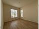 Bright bedroom with large window and wood floors at 12900 Se 97Th Terrace Rd, Summerfield, FL 34491