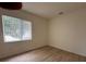 Simple bedroom with window and wood flooring at 12900 Se 97Th Terrace Rd, Summerfield, FL 34491