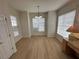 Bright dining room with hardwood floors and bay window at 12900 Se 97Th Terrace Rd, Summerfield, FL 34491