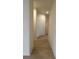 Hallway with light flooring and neutral walls at 12900 Se 97Th Terrace Rd, Summerfield, FL 34491